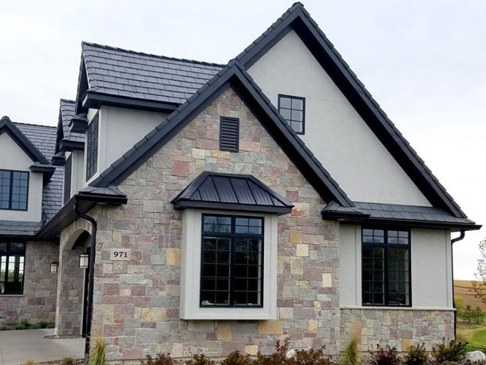 This image shows a luxury home with new soffits on the exterior.