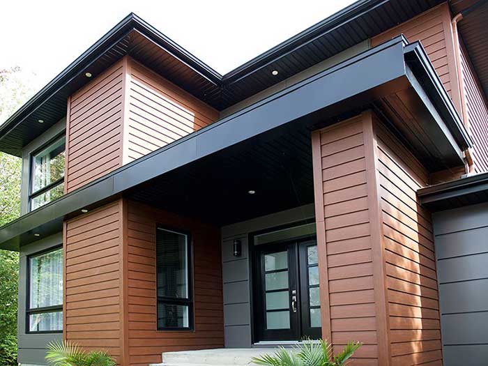 This image shows beautiful brown siding on a luxury home in Fuquay-Varina, North Carolina.